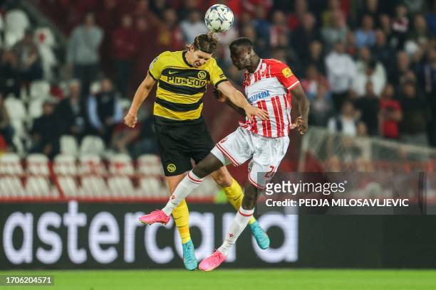 Young Boys' Swiss forward Cedric Itten fights for the ball with Red Star's Burkinabe defender Nasser Djiga during the UEFA Champions League 1st round...