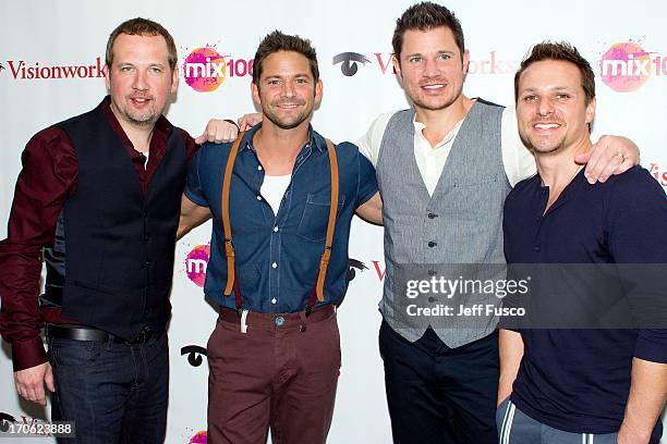 Justin Jeffre, Jeff Timmons, Nick Lachey and Drew Lachey of 98 Degrees pose at the WISX Performance Theater on June 15, 2013 in Bala Cynwyd,...