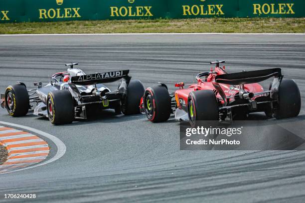 Rear view of the car from Charles Leclerc of Monaco driving the car no 16, a Ferrari SF-23 of Scuderia Ferrari F1 Team following Liam Lawson of New...