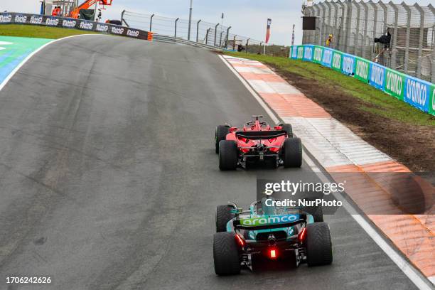 Rear view of the car of Charles Leclerc of Monaco driving the car no 16, a Ferrari SF-23 of Scuderia Ferrari F1 Team followed by Fernando Alonso of...