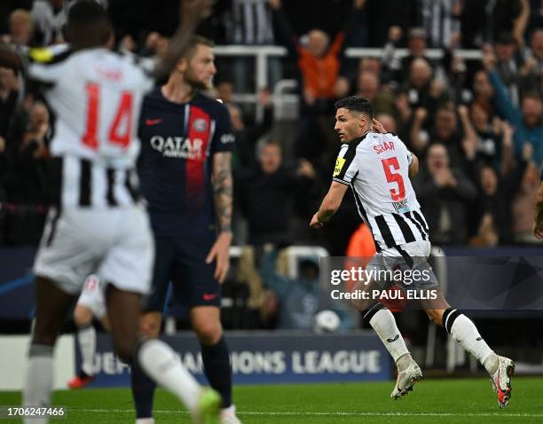 Newcastle United's Swiss defender Fabian Schar celebrates scoring the team's fourth goal during the UEFA Champions League Group F football match...