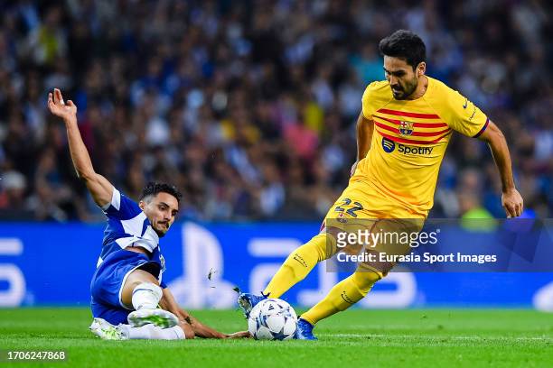 Lkay Gundogan of Barcelona dribbles Stephen Eustaquio of FC Porto during the UEFA Champions League Group Stage Group H match between FC Porto and FC...