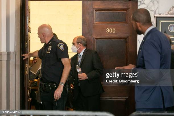 Donald Bender, former accountant at Mazars USA, center, enters a courtroom at New York State Supreme Court in New York, US, on Wednesday, Oct. 4,...