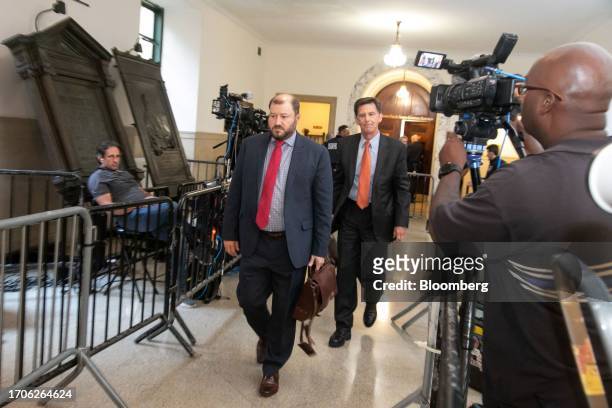 Camron Harris, accountant at Whitley Penn, center, leaves a courtroom at New York State Supreme Court in New York, US, on Wednesday, Oct. 4, 2023....