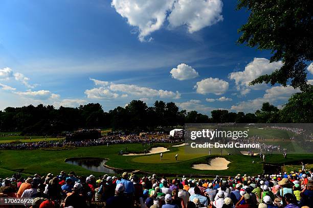 Tiger Woods of the United States putts on the ninth green during Round Three of the 113th U.S. Open at Merion Golf Club on June 15, 2013 in Ardmore,...