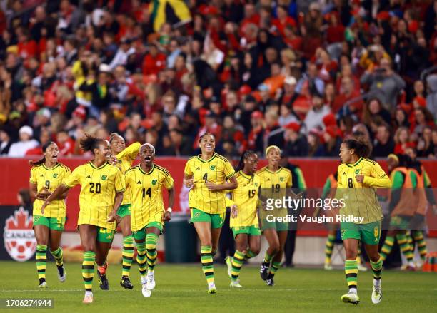 Atlanta Primus, Deneisha Blackwood and Chantelle Swaby of Jamaica celebrate with teammates after a goal by Drew Spence during a Paris 2024 Olympic...