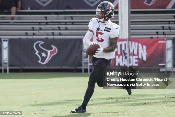 Houston Texans safety Jalen Pitre makes a catch during a drill during an NFL training camp Wednesday, July 26 in Houston.