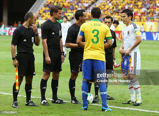 Thiago Silva of Brazil and Makoto Hasebe of Japan talk to Referee Pedro Proenca prior to the FIFA Confederations Cup Brazil 2013 Group A match...