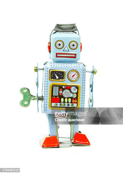retro tin toy robot - clockwork toy stock pictures, royalty-free photos & images