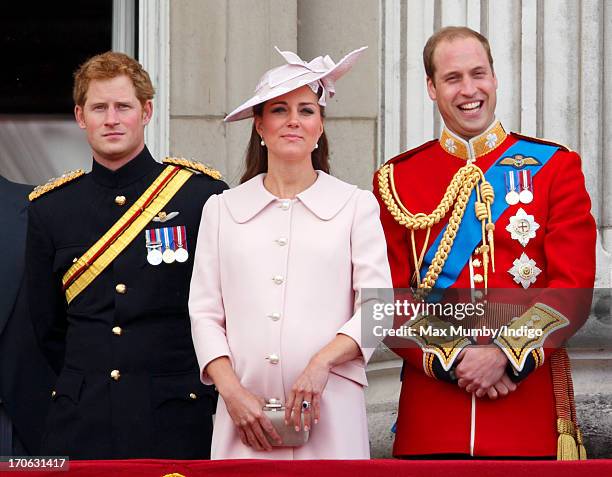 Prince Harry, Catherine, Duchess of Cambridge and Prince William, Duke of Cambridge stand on the balcony of Buckingham Palace during the annual...
