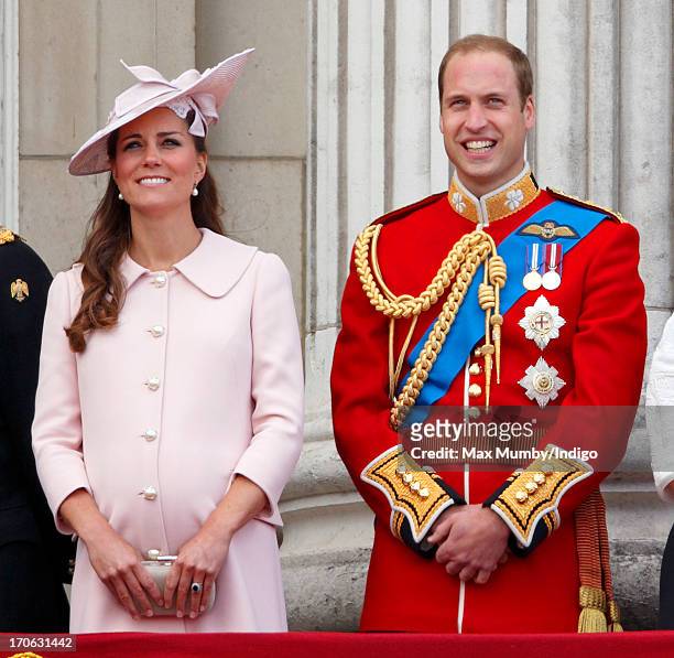 Catherine, Duchess of Cambridge and Prince William, Duke of Cambridge stand on the balcony of Buckingham Palace during the annual Trooping the Colour...