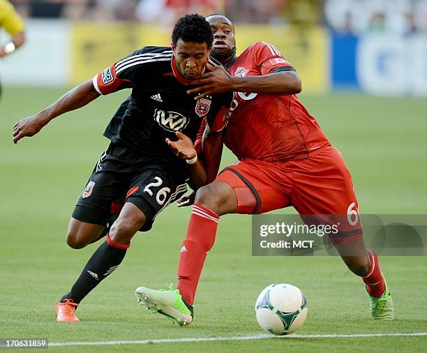 United forward Lionard Pajoy attempts to break in on goal against Toronto FC defender Gale Agbossoumonde in the first half at RFK Stadium in...