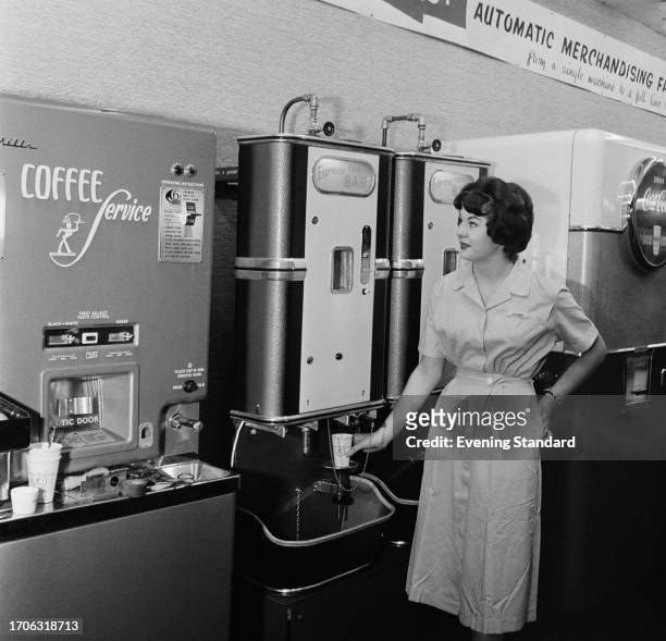 Woman demonstrates a coffee machine at the British Food Fair, Olympia, London, September 4th 1958.