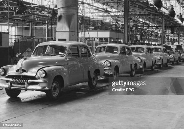 Holden FJ Standard Sedan motor cars coming off the production line of the General Motors-Holden production facility in Melbourne, Victoria,...