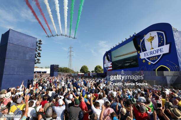 The Frecce Tricolori perform a display over the crowd and stage during the opening ceremony for the 2023 Ryder Cup at Marco Simone Golf Club on...