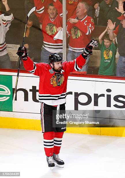 Patrick Sharp of the Chicago Blackhawks celebrates after scoring a goal in the first period against Tuukka Rask of the Boston Bruins in Game Two of...