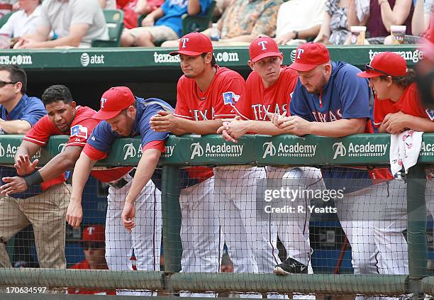 Elvis Andrus, Colby Lewis, Yu Darvish, Nick Tepesch, Matt Harrison and Derek Holland look on from the \do during the game against the Toronto Blue...