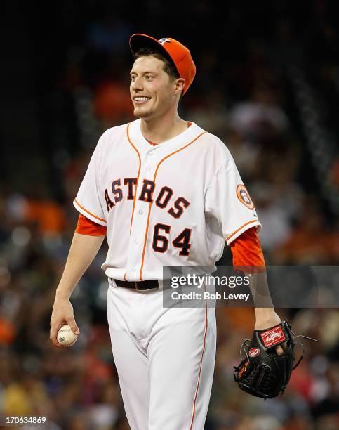 Lucas Harrell of the Houston Astros reacts to giving up a home run to Adam Dunn of the Chicago White Sox in the seventh inning at Minute Maid Park on...