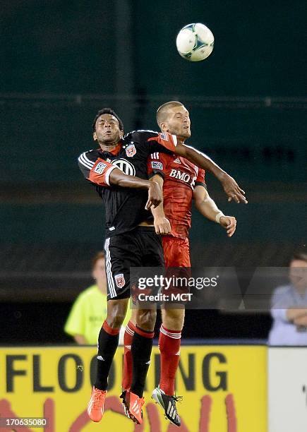 United forward Lionard Pajoy , left, and Toronto FC defender Ryan Richter go up for a head ball in the second half at RFK Stadium in Washington,...