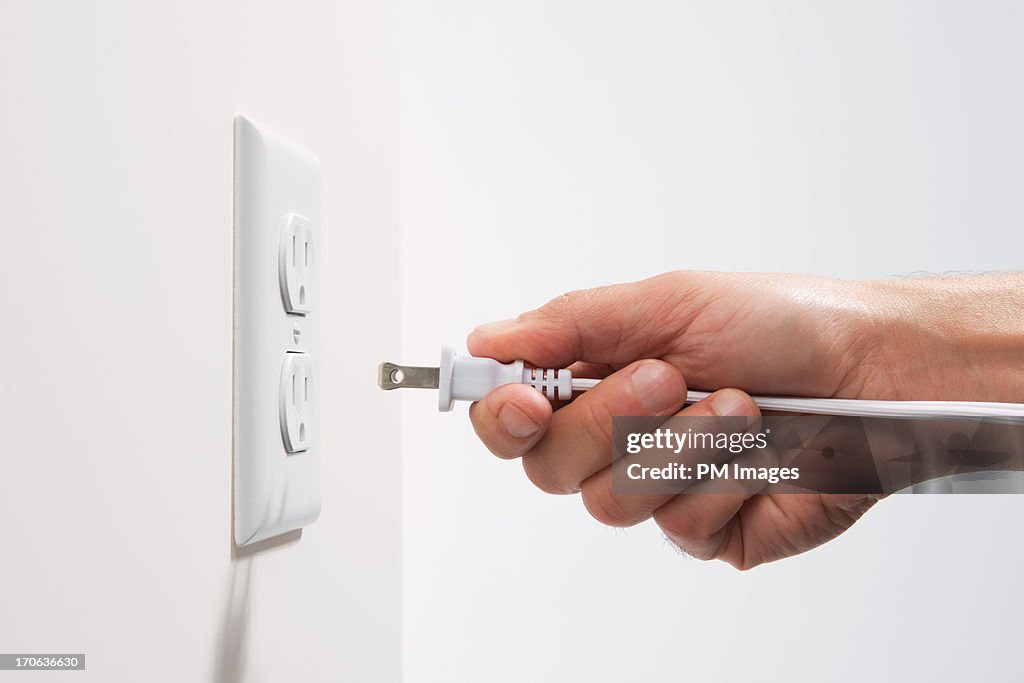 Man about to plug in