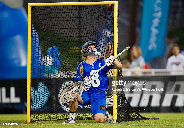 Adam Ghitelman of the Charlotte Hounds can only watch as this shot on goal bounces just under the cross bar during the game against the Boston...