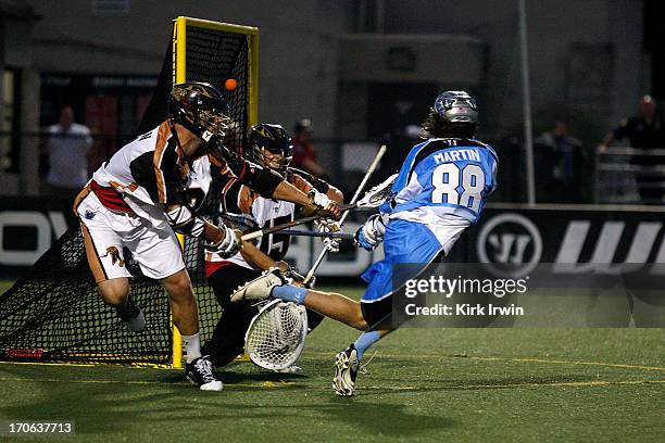 Connor Martin of the Ohio Machine beats John Galloway of the Rochester Rattlers for a goal during the third quarter on June 15, 2013 at Selby Stadium...