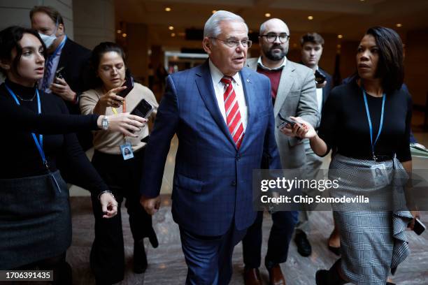 Sen. Bob Menendez talks to journalists after addressing a closed Democratic caucus meeting at the U.S. Capitol on September 28, 2023 in Washington,...