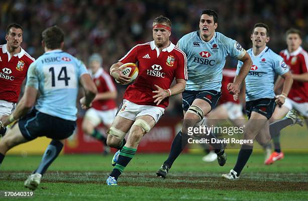 Jamie Heaslip of the Lions charges upfield during the match between the NSW Waratahs and the British & Irish Lions at Allianz Stadium on June 15,...