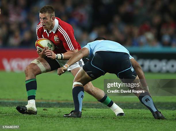 Dan Lydiate of the Lions runs with the ball during the match between the NSW Waratahs and the British & Irish Lions at Allianz Stadium on June 15,...