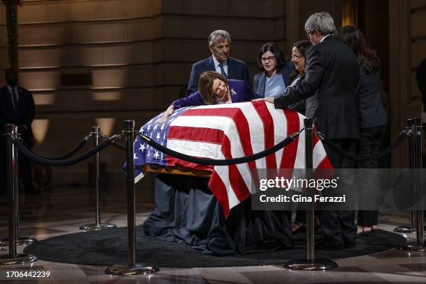 San Francisco, CA Rep Nancy Pelosi, left, pays her respects to Sen. Dianne Feinstein, as she lies in state at San Francisco City Hall on Wednesday,...