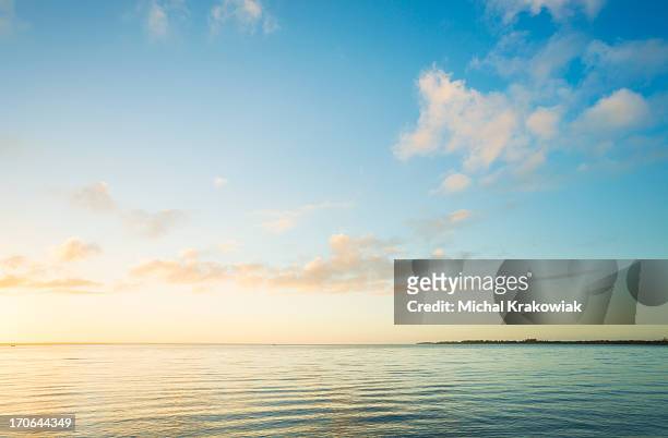 sunrise over sea - horizon over land stock pictures, royalty-free photos & images