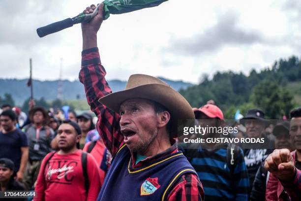 Indigenous people block a road during a protest demanding the resignation of Attorney General Consuelo Porras and prosecutor Rafael Curruchiche in...