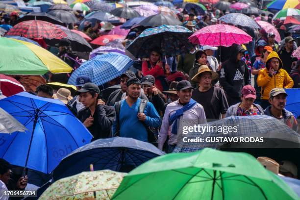 Indigenous people block a road during a protest demanding the resignation of Attorney General Consuelo Porras and prosecutor Rafael Curruchiche in...