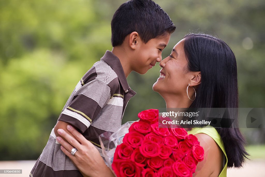 Asian mother and son touching noses