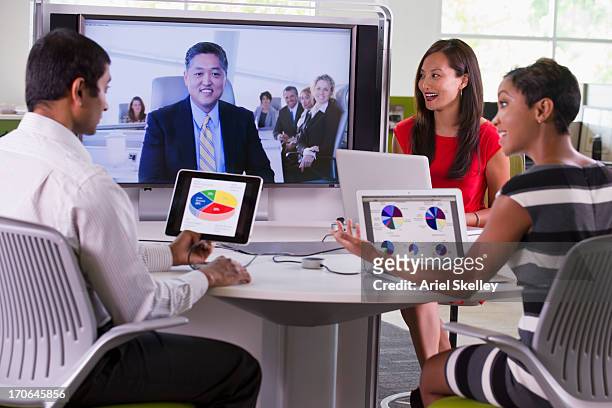 business people working in teleconference - native korean stock pictures, royalty-free photos & images