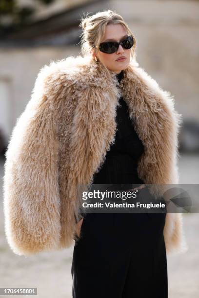 Toni Garrn is seen wearing a fur coat outside Givenchy show during the Womenswear Spring/Summer 2024 as part of Paris Fashion Week on September 28,...
