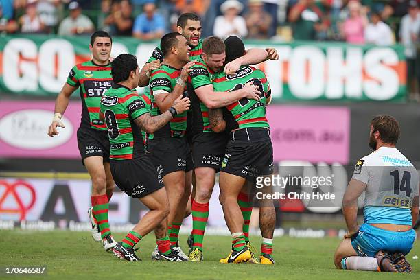 Roy Asotasi of the Rabbitohs is congratulated by team mates after scoring a try during the round 14 NRL match between the South Sydney Rabbitohs and...