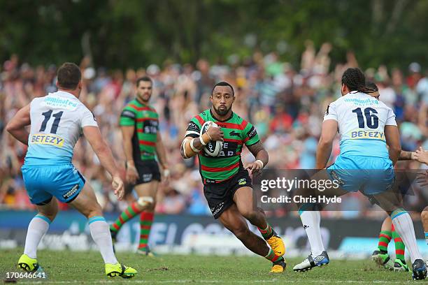 Roy Asotasi of the Rabbitohs runs the ball during the round 14 NRL match between the South Sydney Rabbitohs and the Gold Coast Titans at Barlow Park...