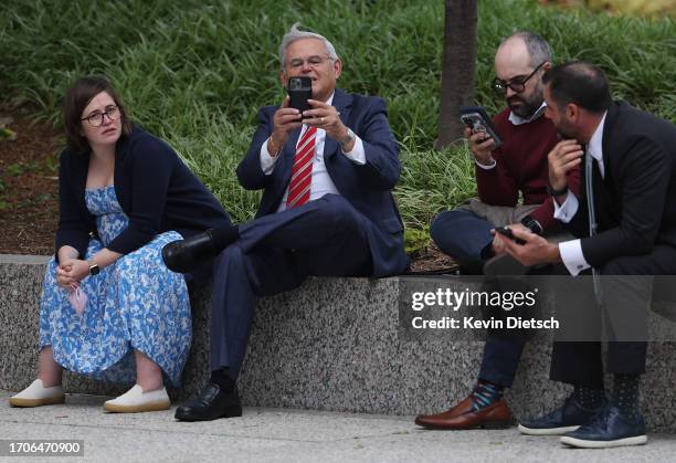 Sen. Bob Menendez sits with staff outside the Hart Senate Office Building on September 28, 2023 in Washington, DC. Menendez requested the opportunity...