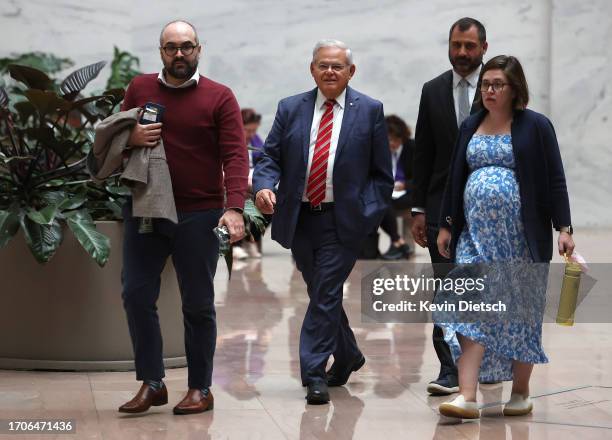 Sen. Bob Menendez walks through the Hart Senate Office Building with members of his staff on September 28, 2023 in Washington, DC. Menendez requested...