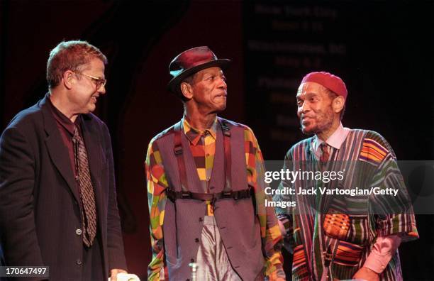 American jazz musicians Ornette Coleman , on alto saxophone, upright acoustic bassist Charlie Haden , and drummer Billy Higgins, during a reunion...