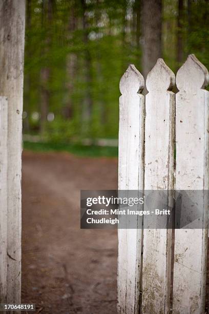 a white picket fence, with an open garden gate. - white picket gate stock pictures, royalty-free photos & images