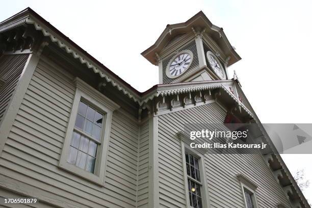 clock tower on old classic wood building in sapporo - turmuhr stock-fotos und bilder