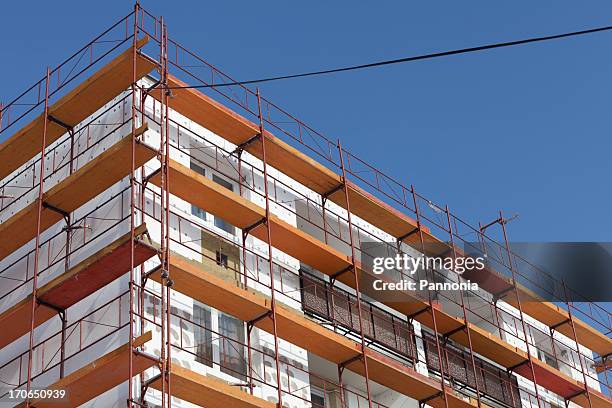 apartment building being insulated - insulation stock pictures, royalty-free photos & images