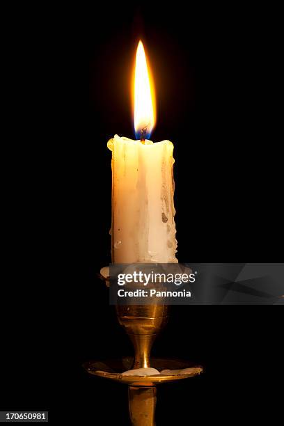 candle on copper holder - candle stock pictures, royalty-free photos & images