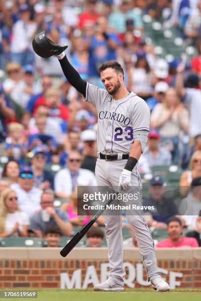 Kris Bryant of the Colorado Rockies acknowledges the crowd as he receives a ovation before his at bat against the Chicago Cubs during the first...