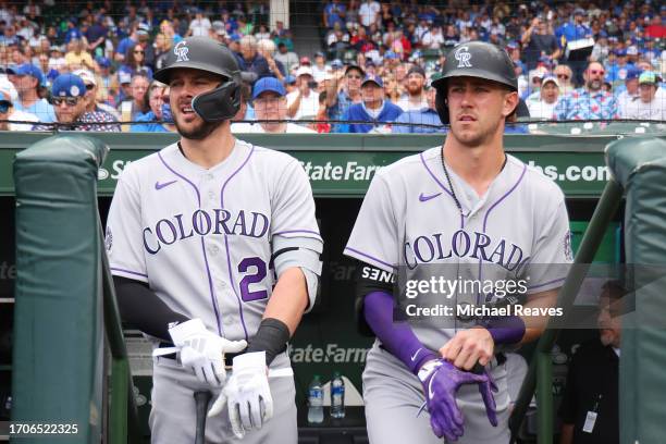 Kris Bryant and Nolan Jones of the Colorado Rockies look on against the Chicago Cubs at Wrigley Field on September 22, 2023 in Chicago, Illinois.