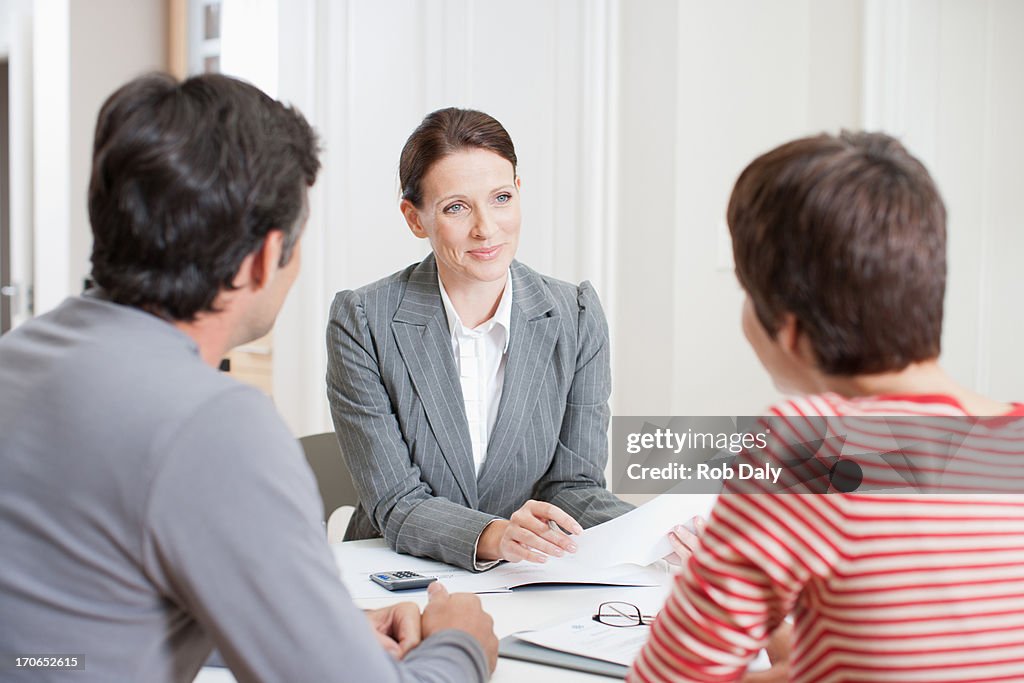 Couple meeting with real estate agent