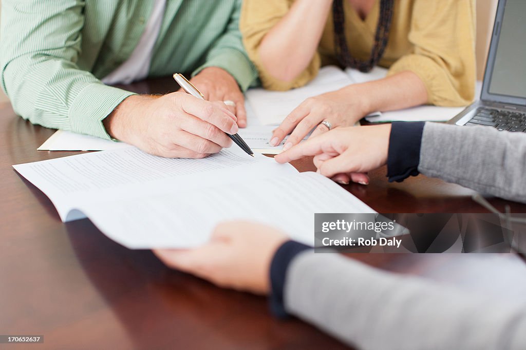 Couple signing contract