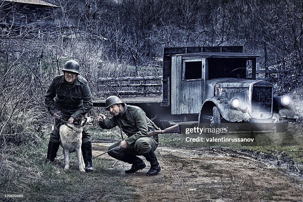 Soldiers and dog